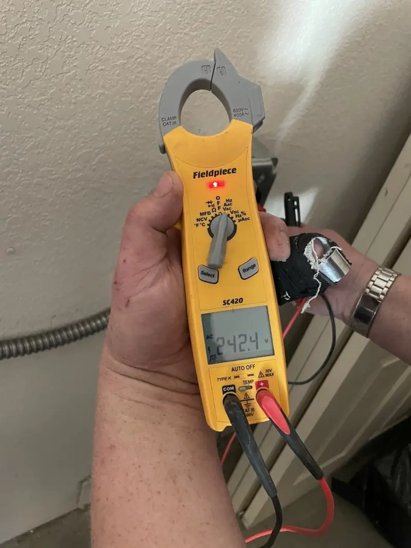 Voltage testing with clamp meter during Whole House Surge Protector in Glenwood